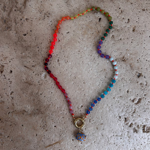 Rainbow necklace with neon orange thread