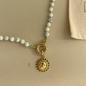 White rainbow necklace with mint thread