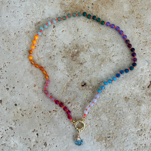 Rainbow necklace with orange thread